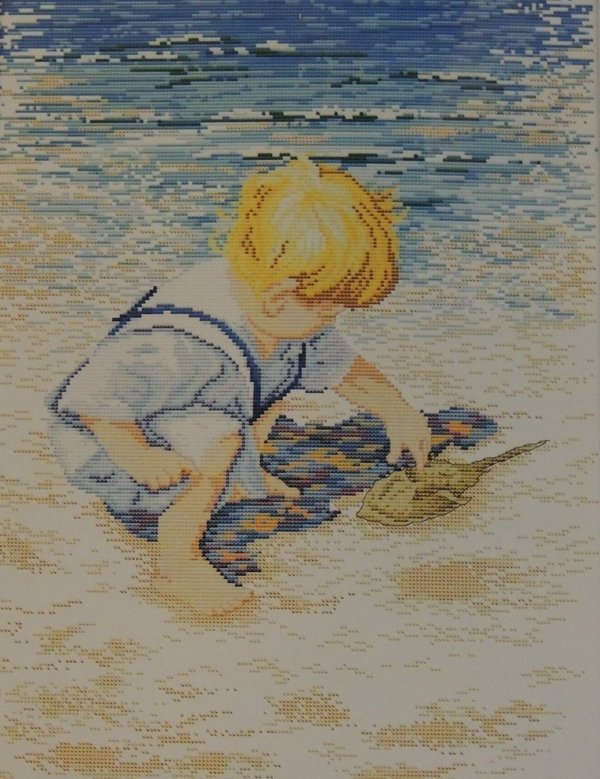 Poika rannalla